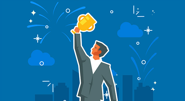 Man in suit holding a trophy